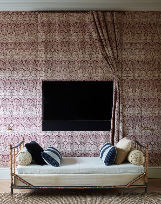 London designer Rose Uniacke hid a telly with matching textile and wall treatments