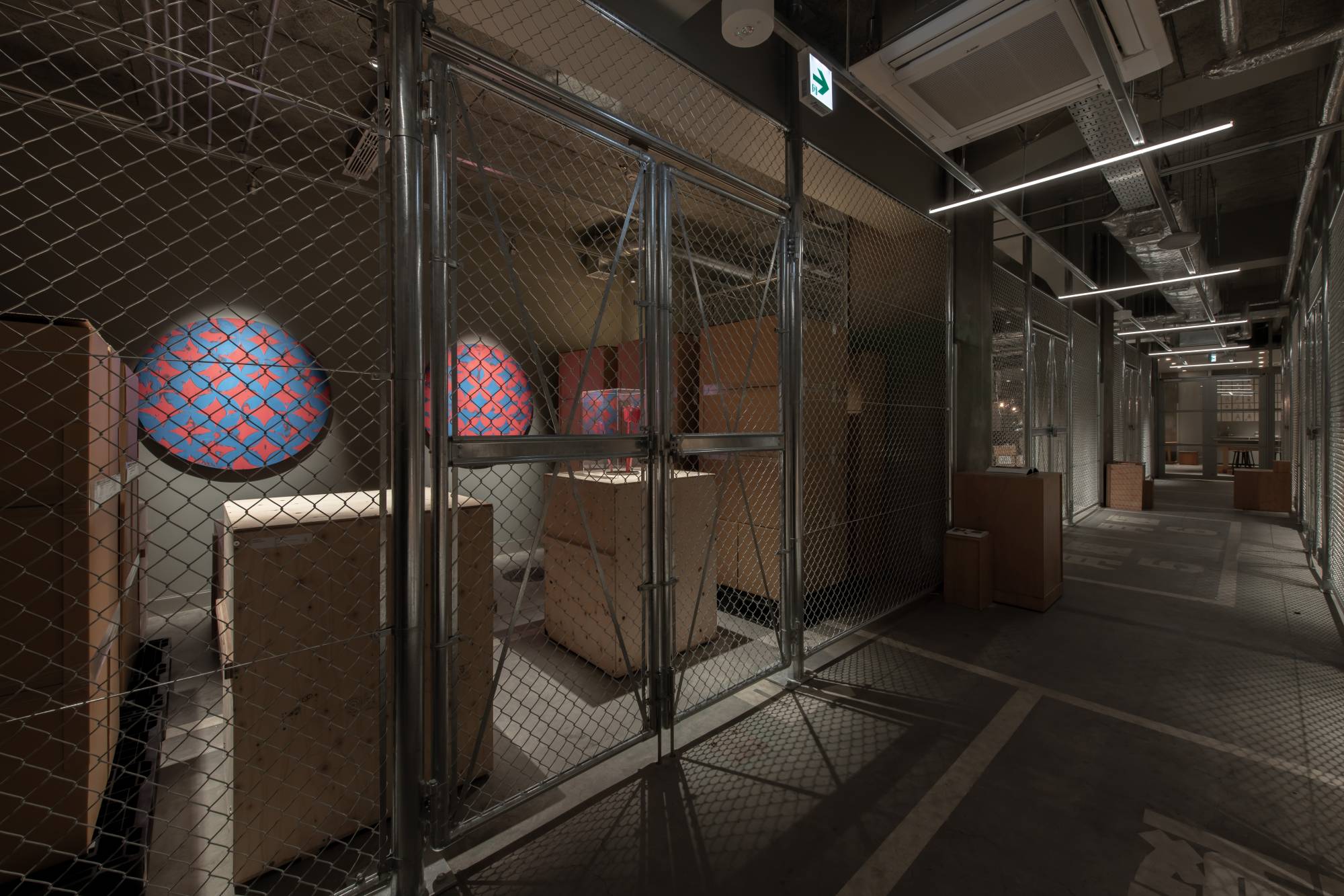 Kaika Tokyo hotel’s art storage area displays artworks that guests can view through its wire fence.