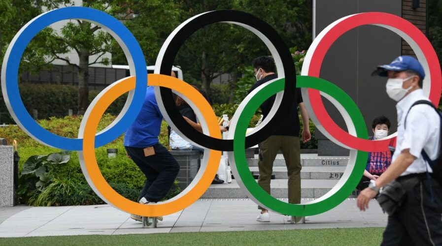 The Olympic rings are displayed near the National Stadium for the Tokyo Olympics. (Photo by Kazuhiro NOGI / AFP)