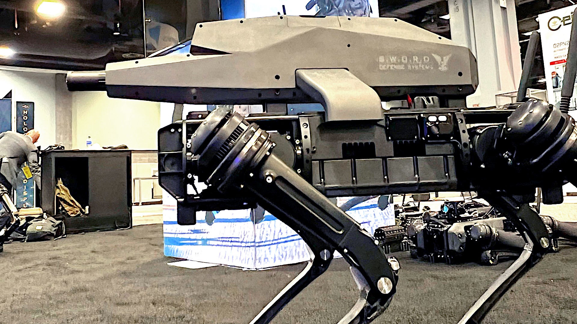 A Ghost Robotics Q-UGV unmanned system with a Special Purpose Unmanned Rifle module on top.