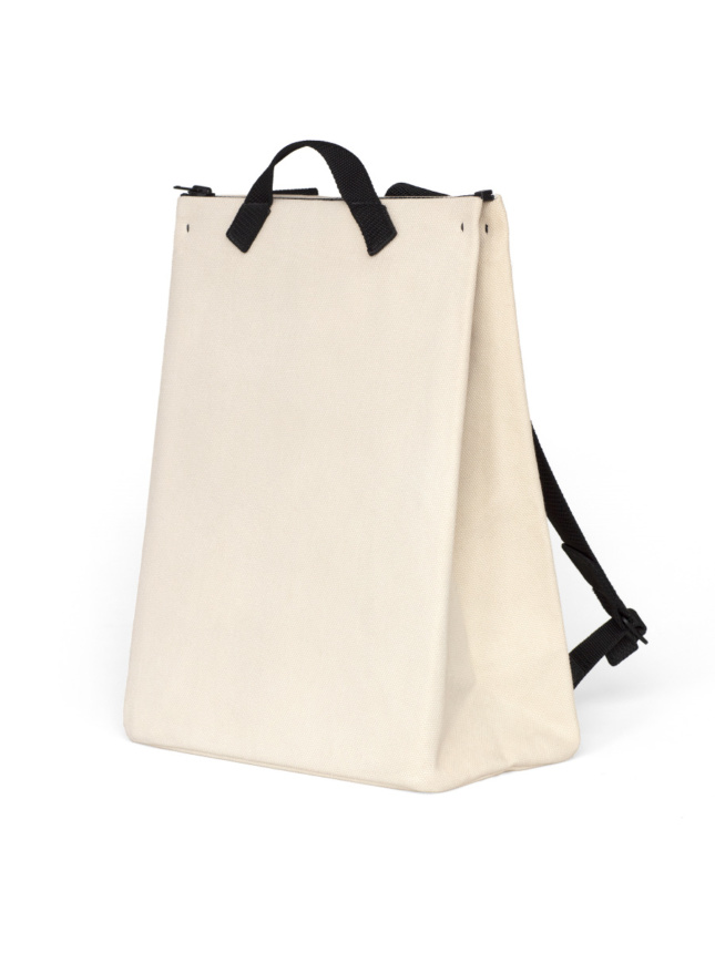 A canvas-colored bag with black straps