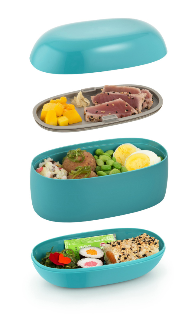 A green bento box broken into different sections