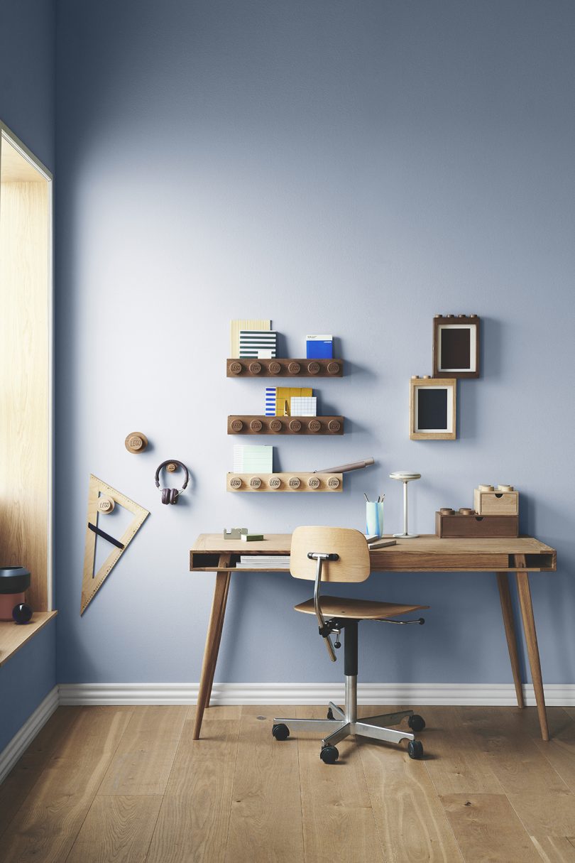 wooden Lego storage drawers, picture frames, wall shelves, and wall hooks in office space