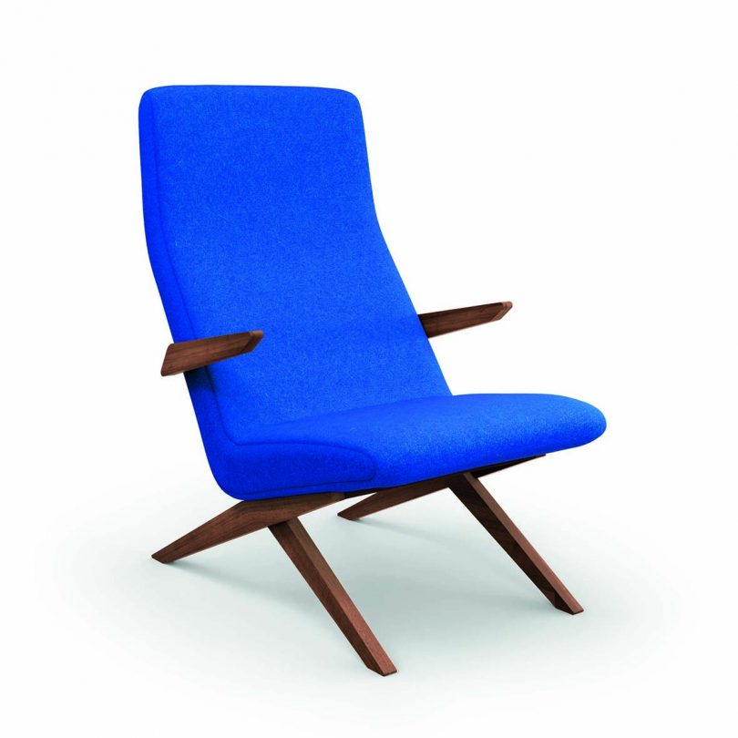 wood armchair upholstered in bright blue on a white background