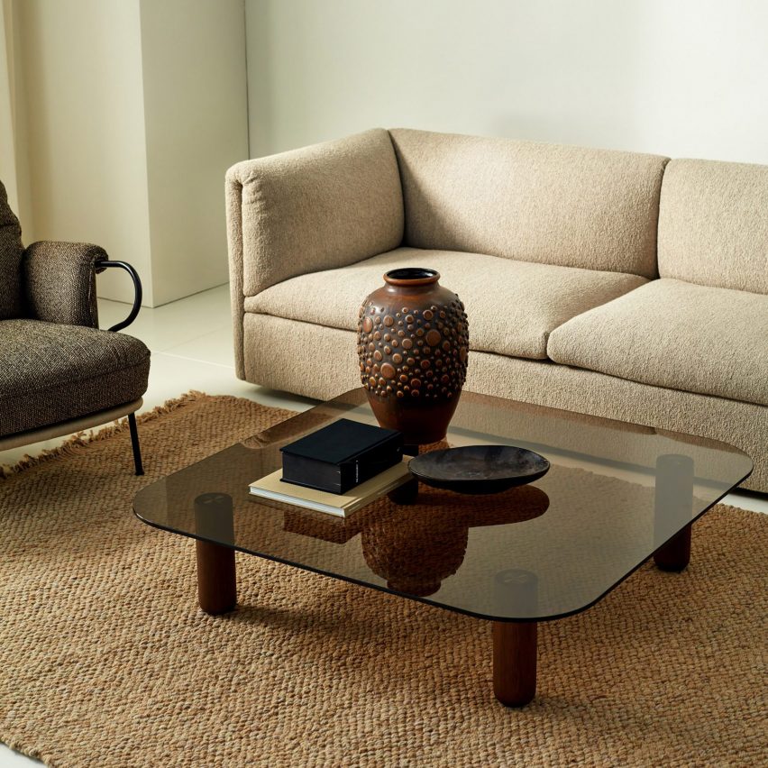 Big Sur Low coffee table by Fogia in brown tinted glass and dark brown legs used in a living room setting